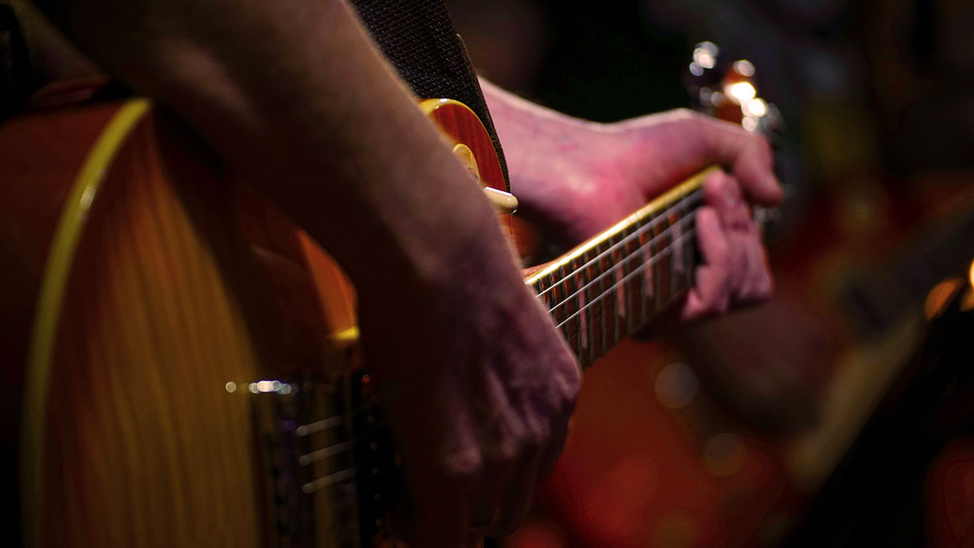 Man playing a guitar