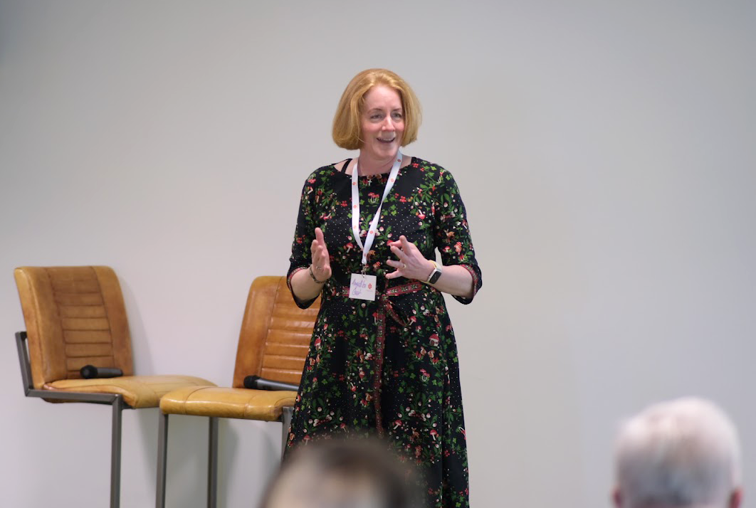 A person in a dress with her hands up

AI-generated content may be incorrect.