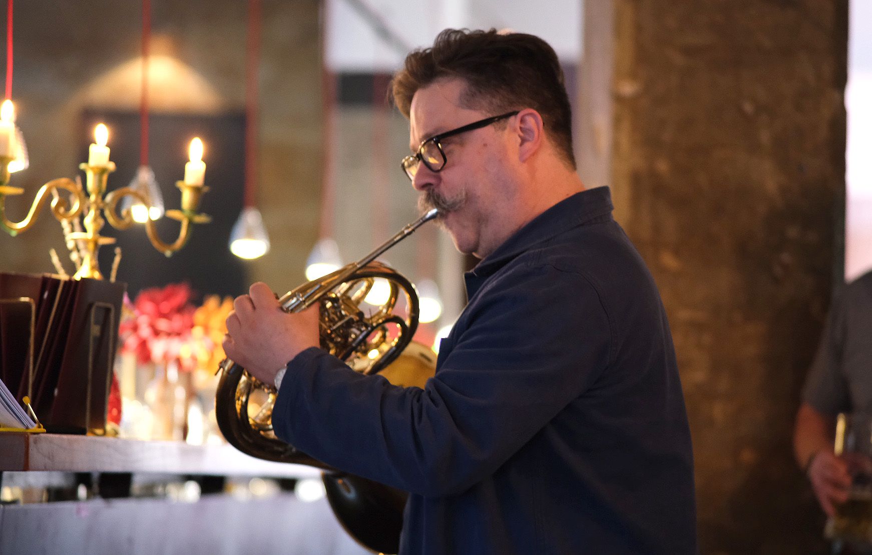A person playing a french horn

AI-generated content may be incorrect.
