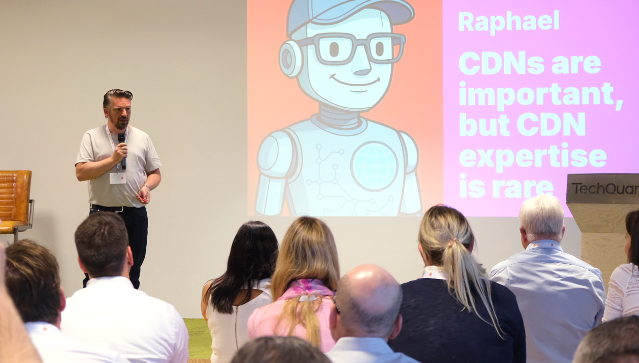 A person standing in front of a crowd watching a person in front of a projector

AI-generated content may be incorrect.