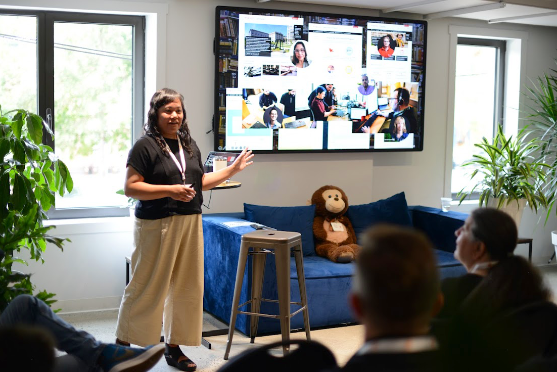 A person standing in front of a large screen

AI-generated content may be incorrect.