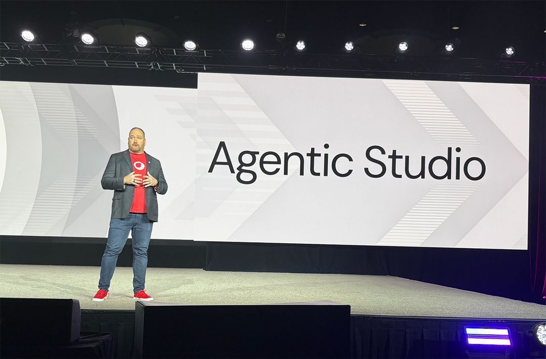 A person standing on a stage

AI-generated content may be incorrect.