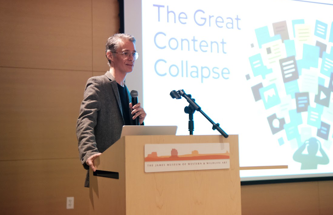 A person standing at a podium with microphones
AI-generated content may be incorrect.