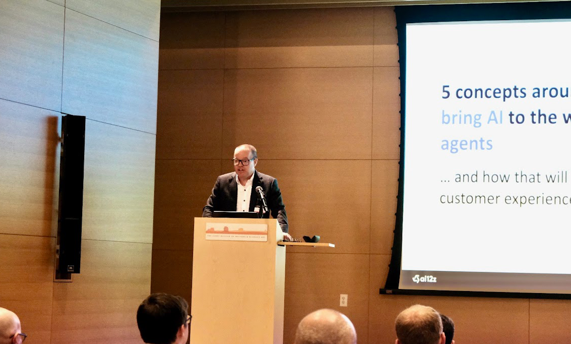 A person standing at a podium with microphones
AI-generated content may be incorrect.