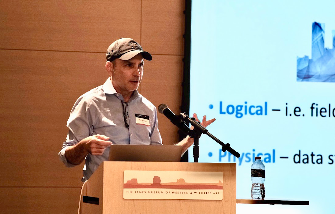 A person speaking at a podium
AI-generated content may be incorrect.