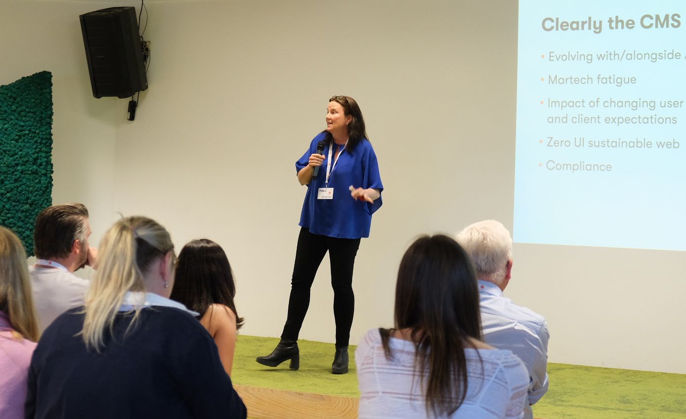 A person speaking into a microphone

AI-generated content may be incorrect.